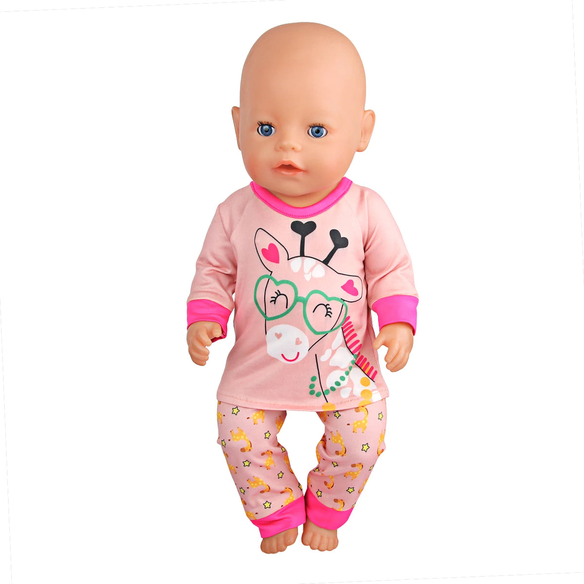 A baby doll wearing a pink unicorn pajama set with a face design and matching pants.