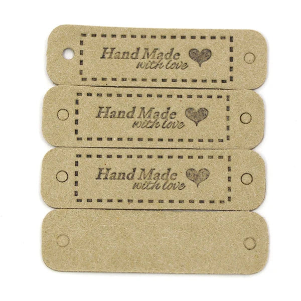 A set of four light brown leather-style handmade with love tags for crafts and sewing.
