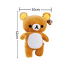 A fluffy brown and white Rilakkuma anime plush bear stuffed toy with yellow ears.