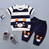 A navy and white striped boys' cotton summer short sleeve t-shirt and shorts set.