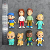 A collection of playful cartoon PVC figurines featuring characters like a school bus, a dog, and various animated figures.