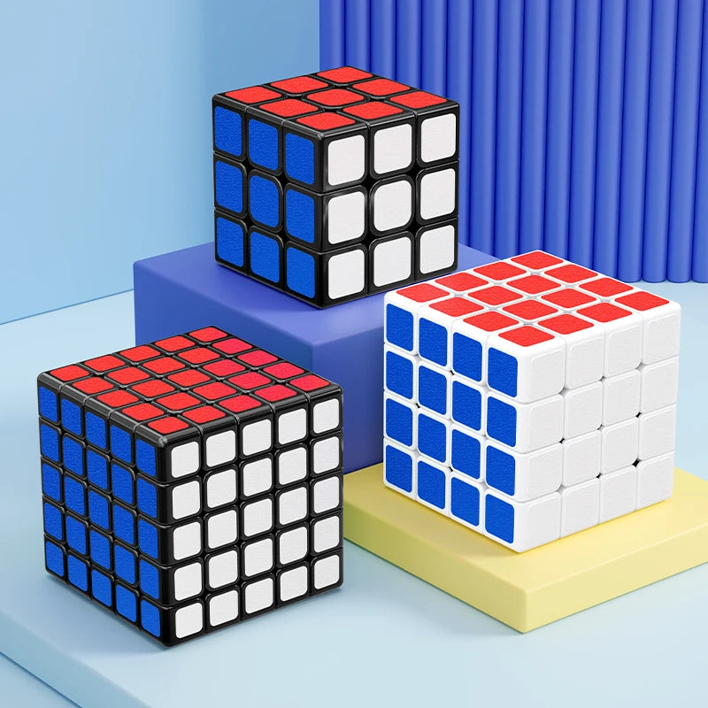A set of three 3x3 magic cubes in red, blue, and white stacked on a light blue surface.