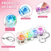 A set of four colorful LED light-up keyboard fidget toys attached to a keychain.