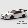A white classic rally car building block set with black accents and a spoiler.