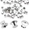 A collection of silver metal locking pins and backs used for brooches, lapel pins, and badges.