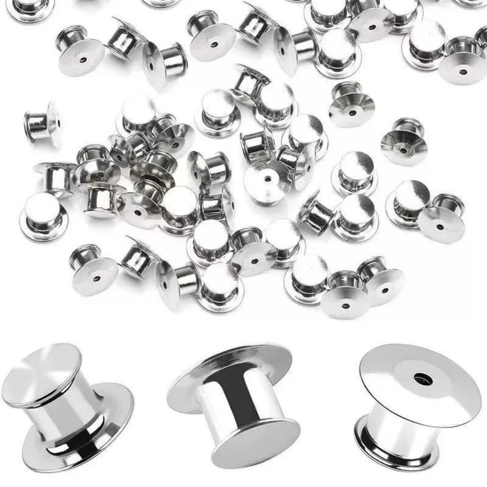 A collection of silver metal locking pins and backs used for brooches, lapel pins, and badges.