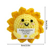 Handmade crochet sunshine doll in bright yellow with a smiling face and inspirational text