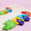 A colorful wooden puzzle featuring cartoon dinosaurs in various shapes and colors.