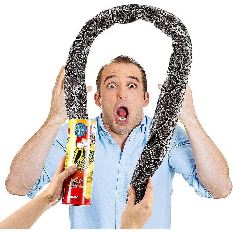 A man is holding a spring snake prank can with a realistic chip design in front of his face.