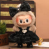 A plush Labubu doll wearing a black plaid outfit and a fluffy hood with a flower detail.