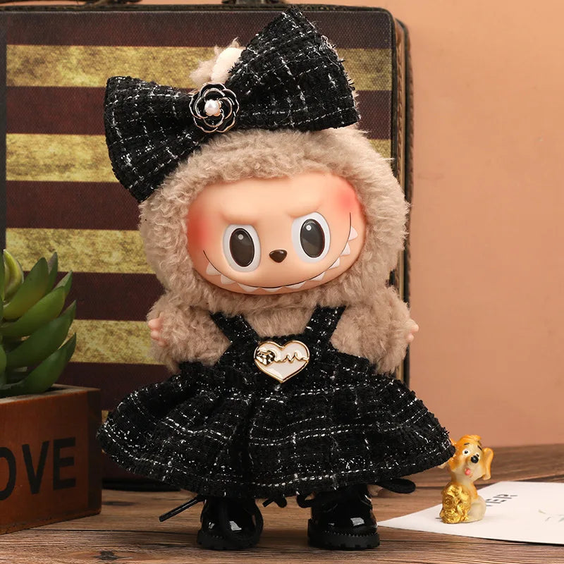 A plush Labubu doll wearing a black plaid outfit and a fluffy hood with a flower detail.