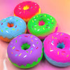 A collection of brightly colored, squishy cartoon donuts in pink, green, and purple for sensory play.