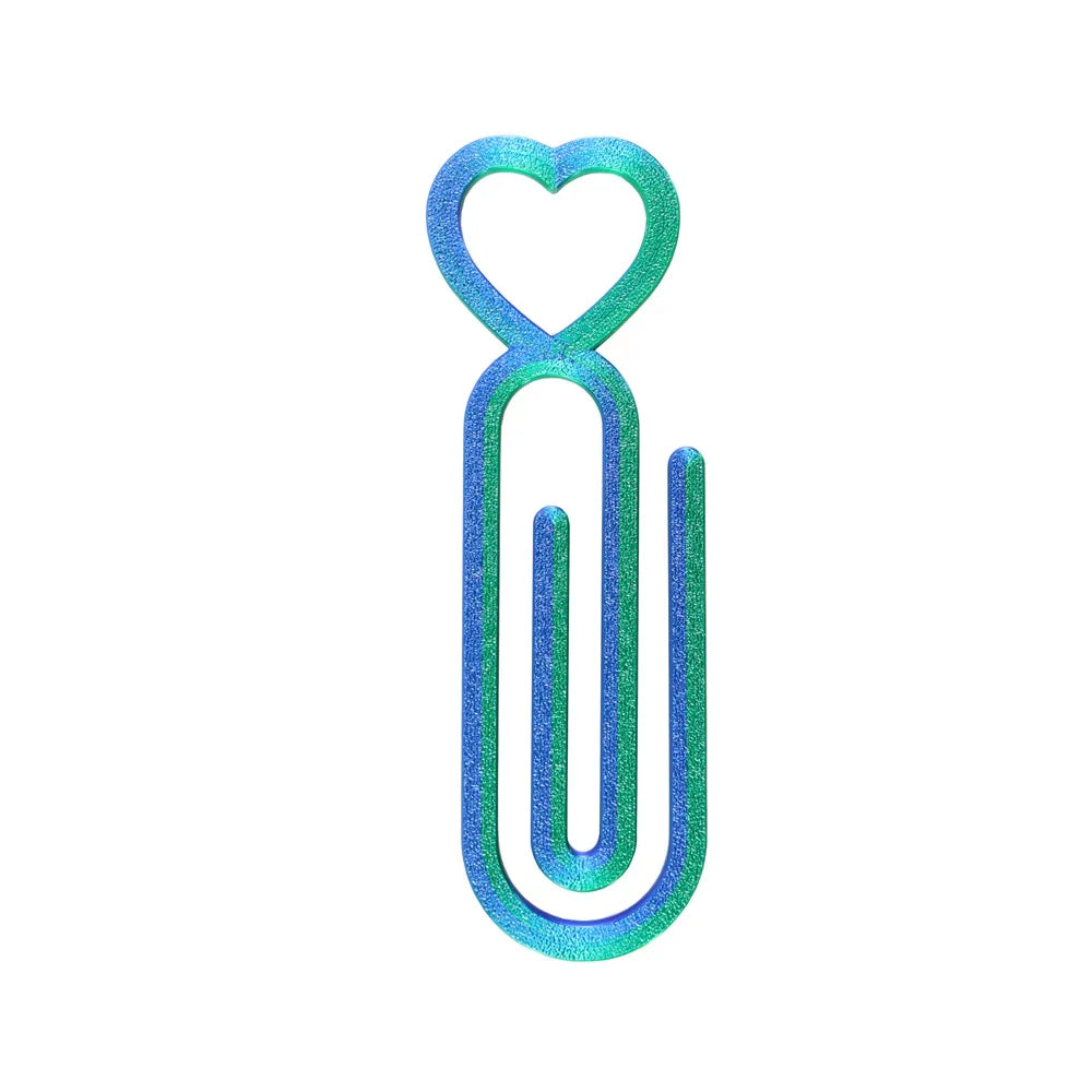 A pair of heart-shaped canvas clips in iridescent blue and green glitter.