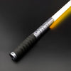 A premium metal lightsaber with an illuminated blade and a textured grip is shown against a dark background.
