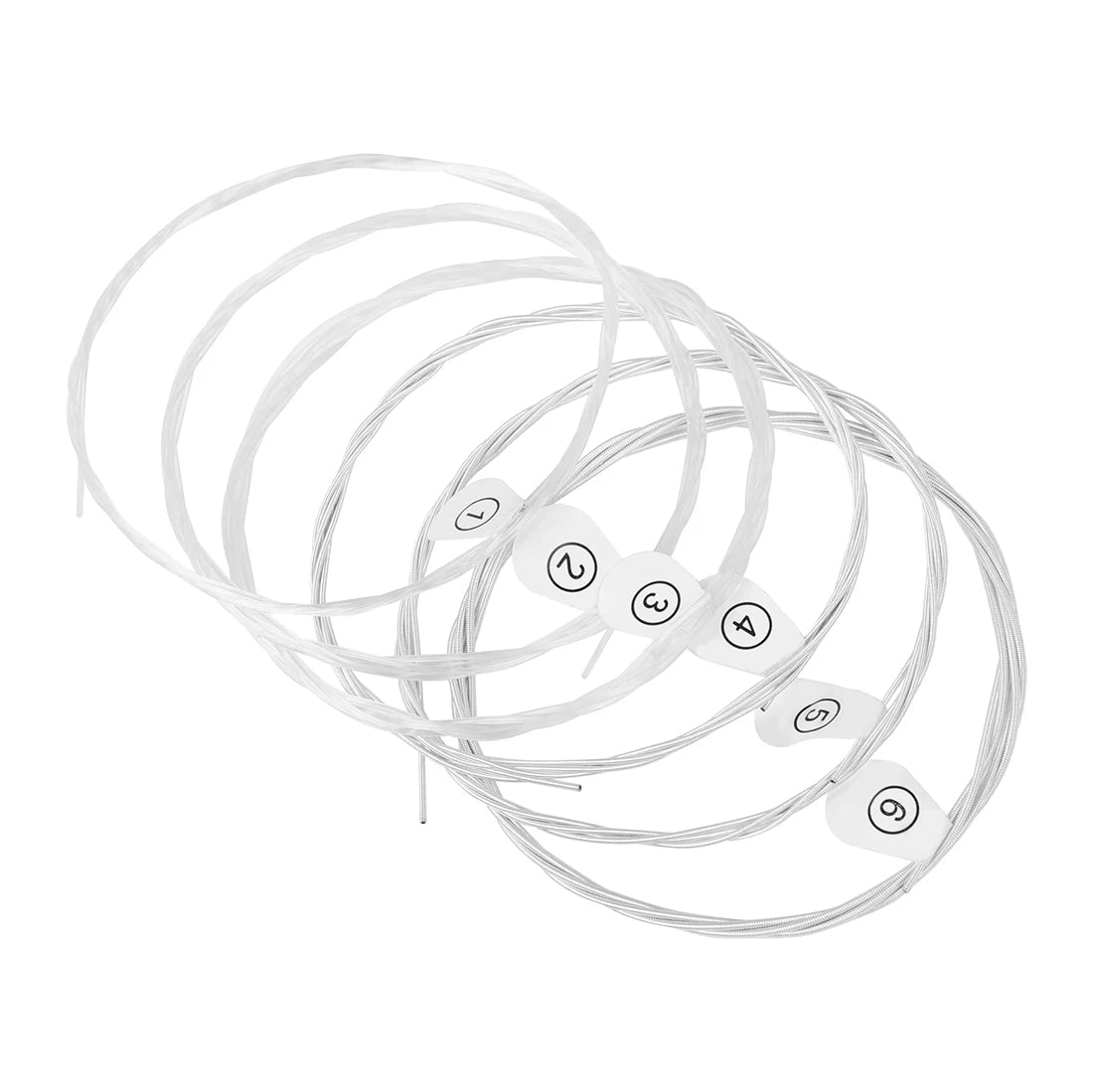 A coiled set of clear nylon and silver-plated copper wound classical guitar strings.