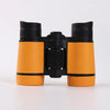 A pair of orange and black binoculars for birdwatching and outdoor adventures.
