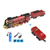 A red vintage steam train set with a remote control and spray effect accessories.