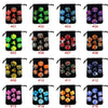 A collection of colored polyhedral dice organized in individual storage bags labeled 01 through 16.