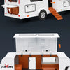 A white diecast metal RV camper truck model with an open storage compartment and exterior features.