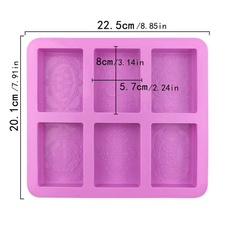 A square pink silicone mold with six cavities featuring a floral pattern for DIY soap making
