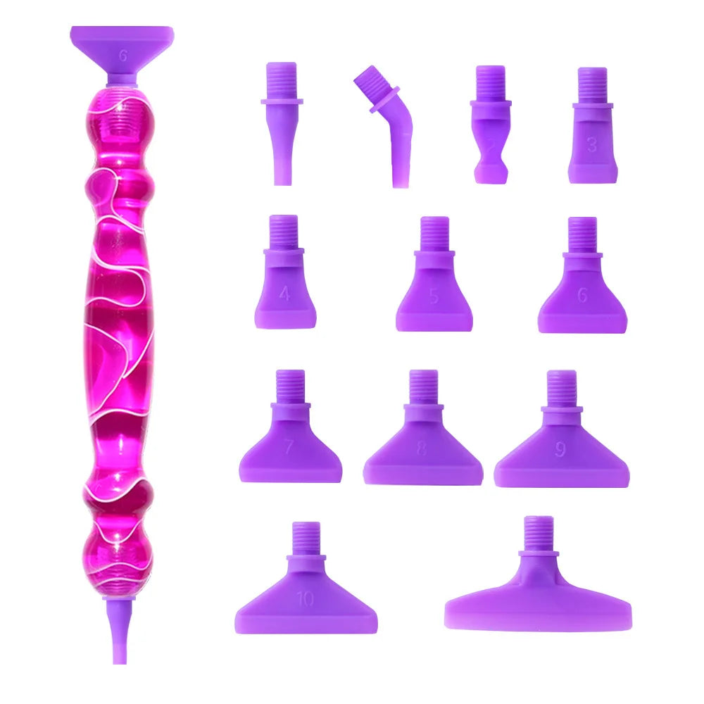 A collection of twelve interchangeable tips for a Diamond Art pen kit, shown in various shades of purple and pink.