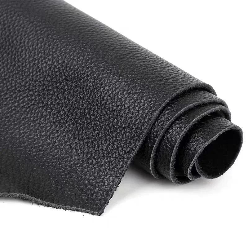 Roll of premium black cowhide leather with a lychee texture
