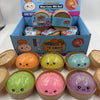 A collection of soft sensory squishy dumpling toys in various colors including orange, yellow, green, pink, and purple.