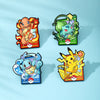 A set of four cute enamel pins featuring Pokémon characters, including Charizard and a Growlithe, displayed against a light b