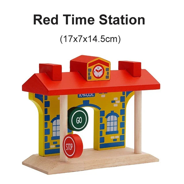 A wooden model of a red time station building with a roof and a green go stop sign.