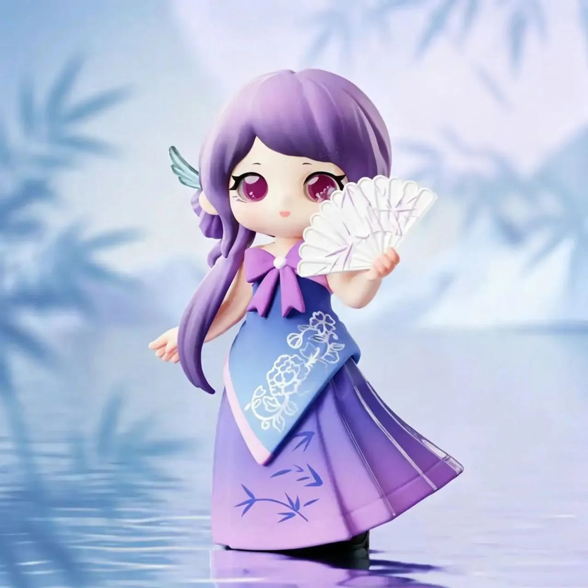 A purple figurine of a girl with long hair and a dress, holding a white fan, set against a light blue background.