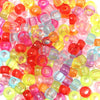 A pile of colorful rainbow pony beads in various shades of pink, orange, yellow, and clear plastic.
