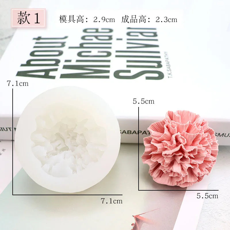 A white silicone mold shaped like a pink flower, next to the finished 3D flower decoration.