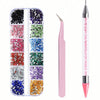 A set of multi-size flat back acrylic rhinestones in various colors displayed alongside a nail art tool.