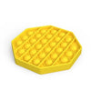 A yellow, hexagonal pop bubble sensory fidget toy with multiple small bubbles.