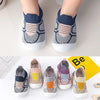 A pair of breathable anti-slip baby first walker shoes in gray and white knitted fabric shown from the top and side.