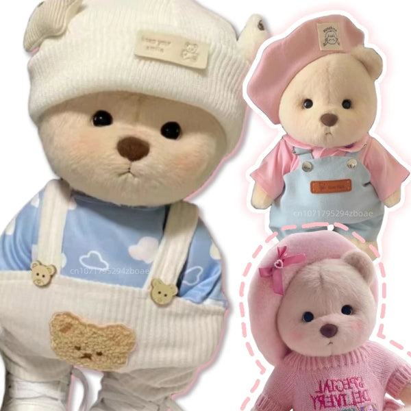 A handmade plush bear cosplay doll wearing a white knit hat and light blue overalls