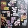 A collection of wooden cat-shaped puzzles featuring various patterns and colors.