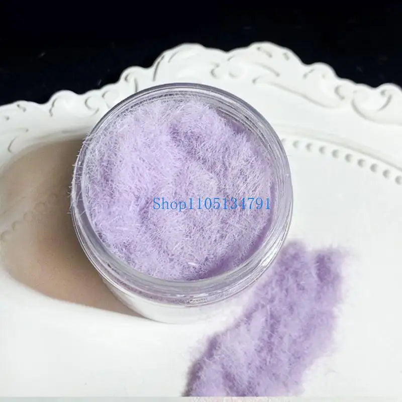 Purple adhesive flocking powder in a clear jar displayed on a white decorative plate.