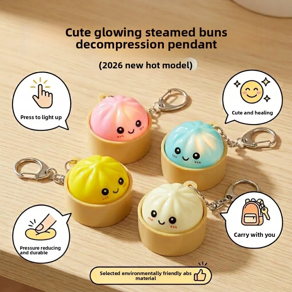 Cute glowing steamed buns decompression pendant in yellow, pink, and blue colors with keychain attachments