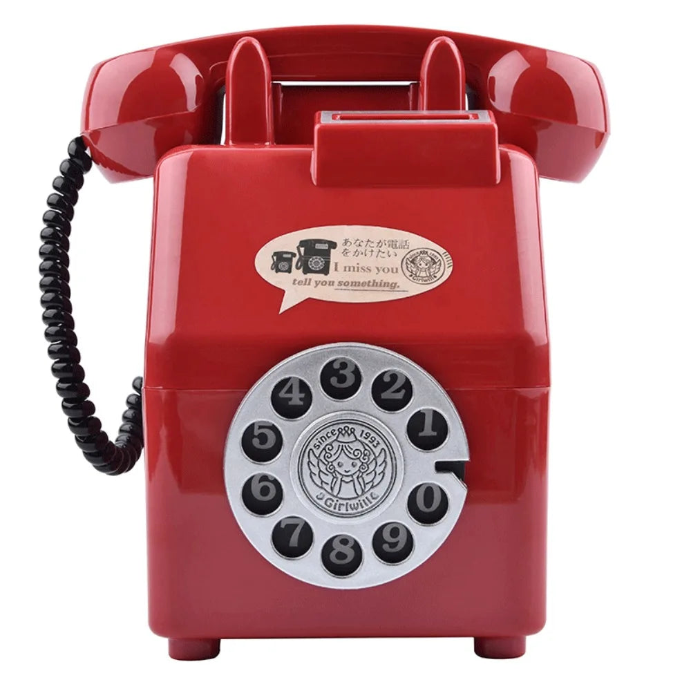 A vintage red rotary telephone shaped piggy bank with a circular dial and a speaker grille.