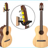 A solid wood acoustic guitar is shown with a close-up view of its wall mount hanger mechanism.