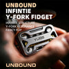A hand holds an Unbound Infinity Y-Fork fidget gadget, a metal magnetic slider with a Y-fork structure.