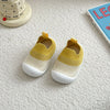 A pair of yellow and white breathable anti-slip baby first walker shoes resting on a white surface.