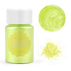 A glass jar of fluorescent lemon yellow pearl powder next to a circular swatch of the same color and a pile of loose powder.