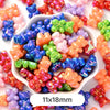 A bowl filled with pastel bear-shaped acrylic craft beads in various colors and a shimmer finish.