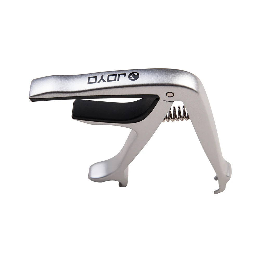 Silver zinc alloy guitar capo with a black grip and metal pins