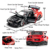 A black and red 1:24 scale diecast GTR sports car model with various features like opening doors, hood, trunk, and lights.