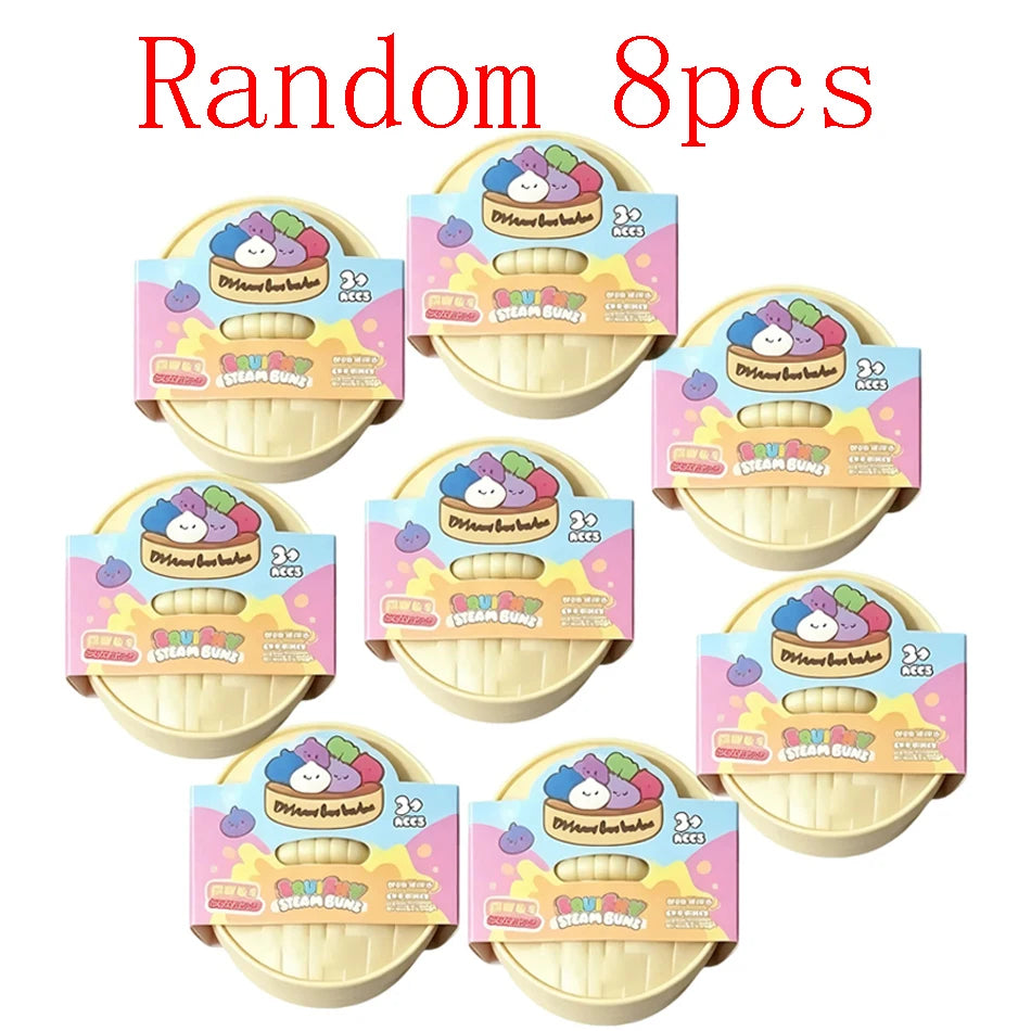 Ein Set von acht zufälligen glitzernden Squishy-Dumpling-Sensorikspielzeugen in verschiedenen Farben und Designs.