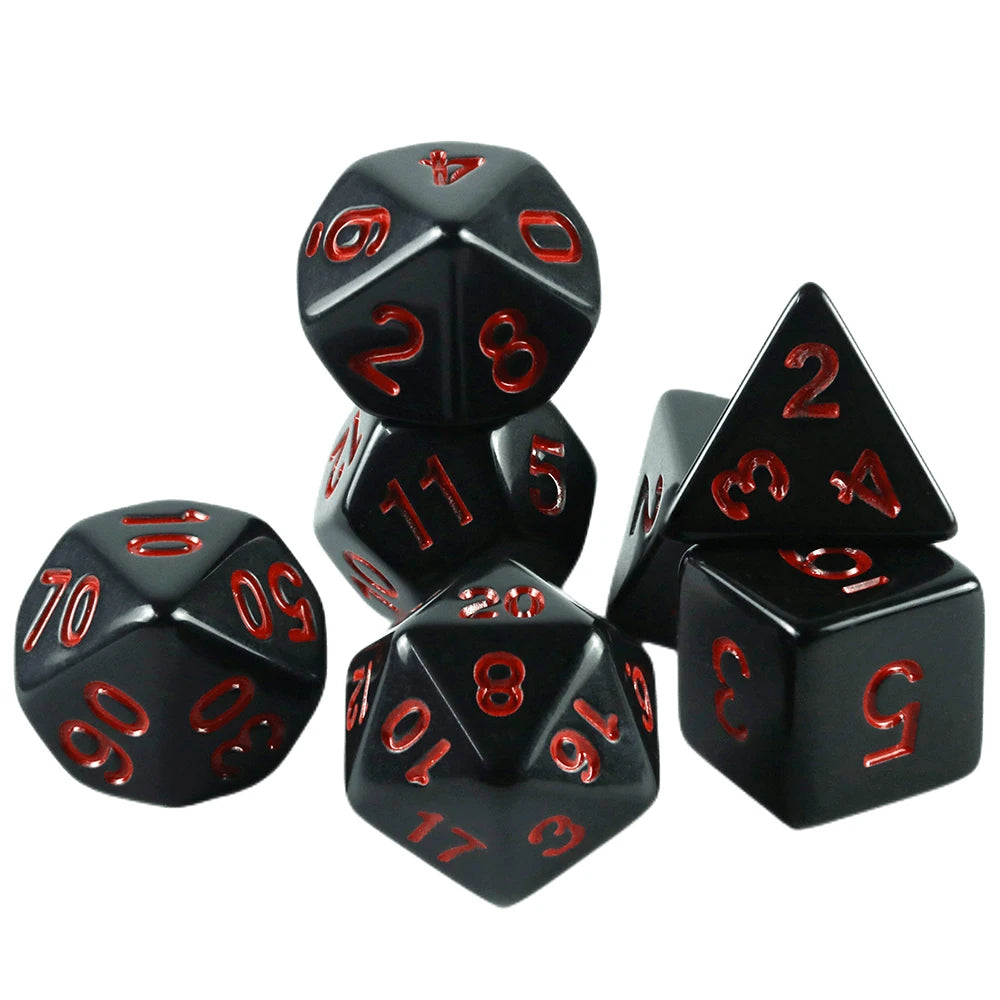 A set of black acrylic dice including a d20, d6, and d8, used for tabletop role-playing games.