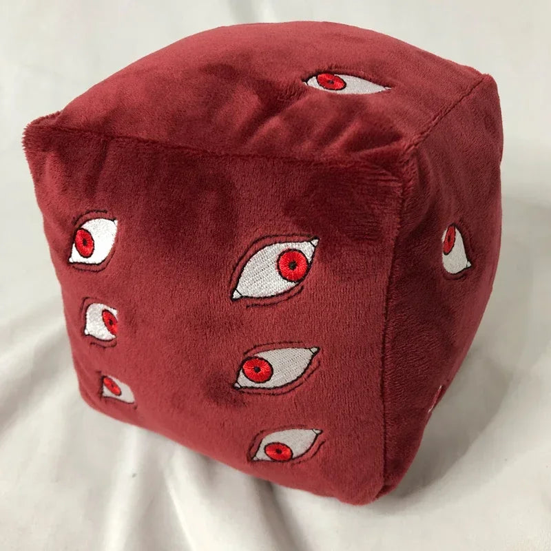 A plush figure of Gojo Satoru with red skin and multiple eyes, featuring a dark red color.